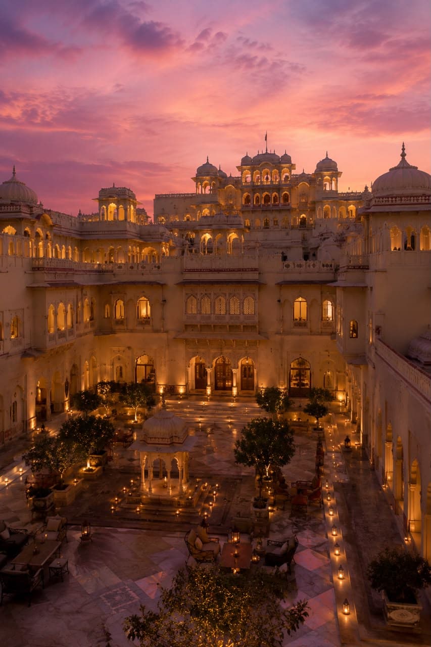 A grand palace courtyard in Rajasthan at dusk